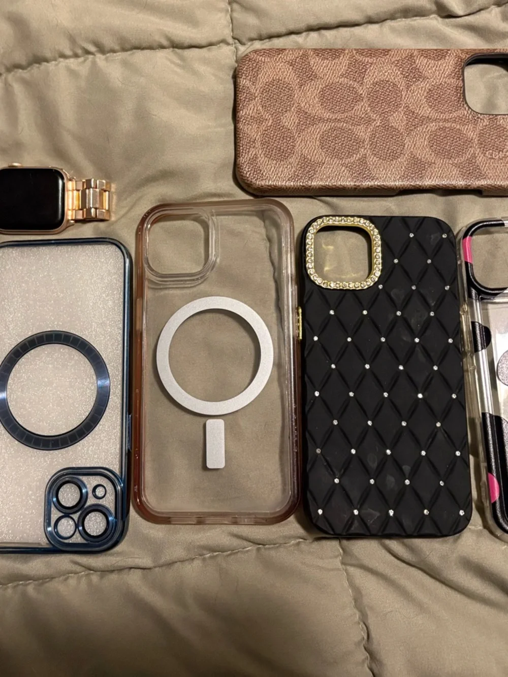 IPhone 14 with accessories cases and watch